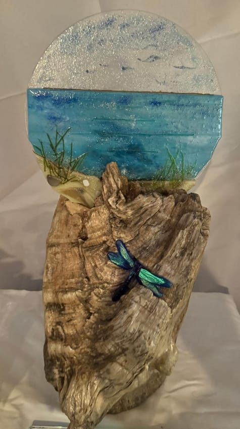 Round fused-glass seascape mounted on a driftwood base